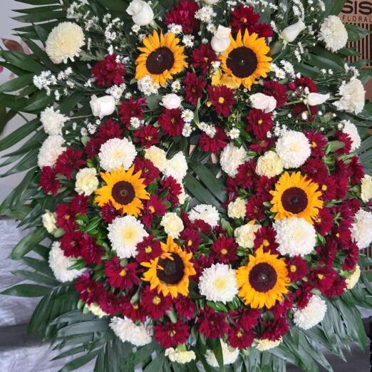 Corona Abrazo Cálido, de Florería Isis